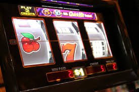 Filipino player enjoying gamezone Casino slots on a mobile phone at home